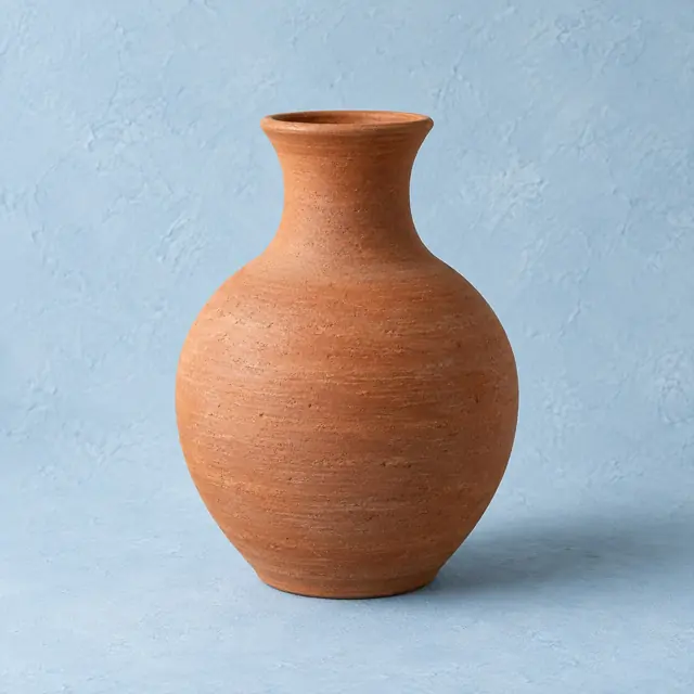 Hand-thrown ceramic vase · warm earth